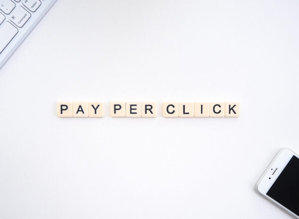 Image showing pay per click written on scrabble-like tiles, on a white table.